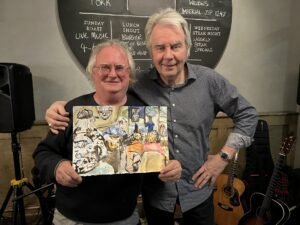 Brian presents Nick with a water colour depiction of the gig.